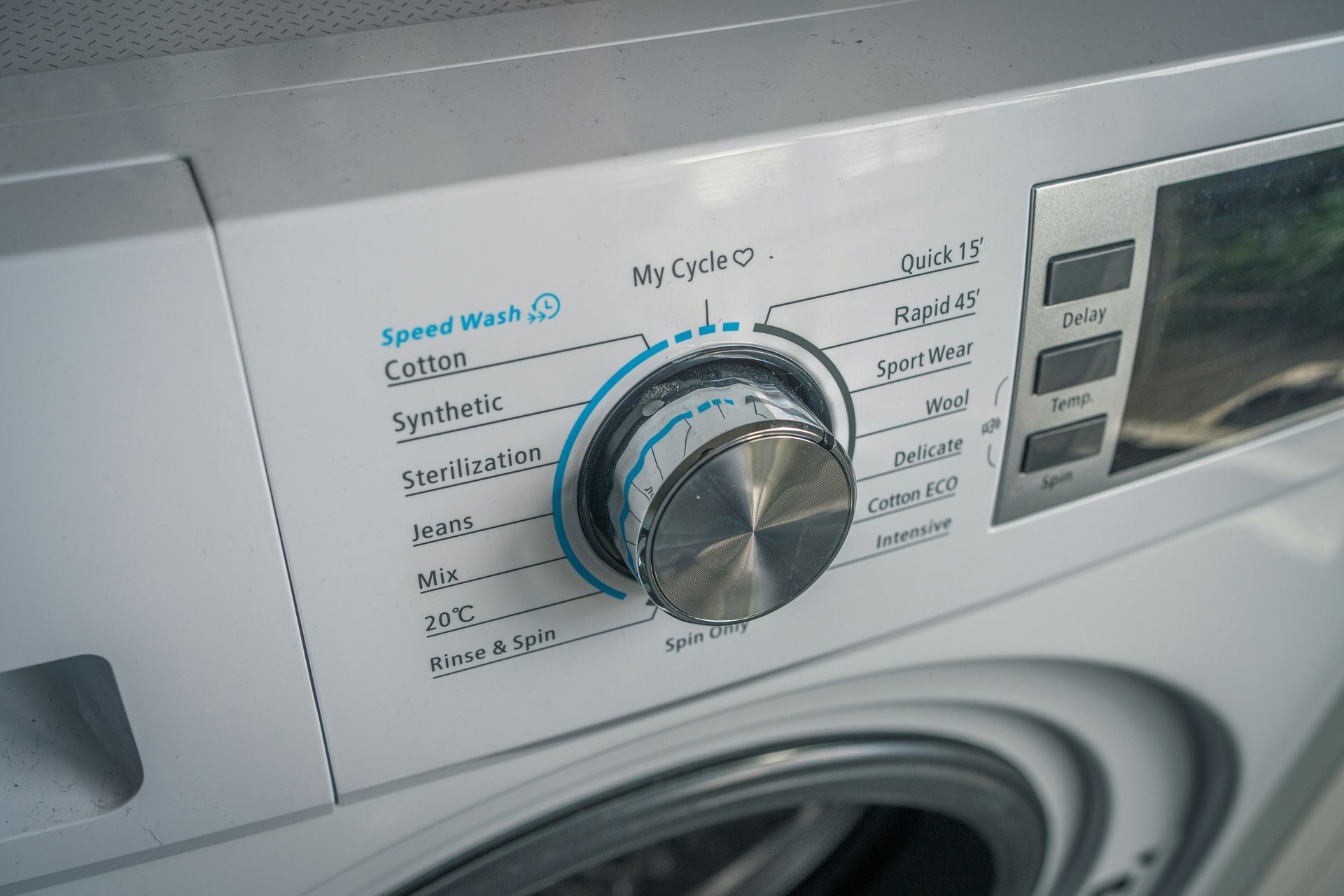 a close up of a washing machine with buttons
